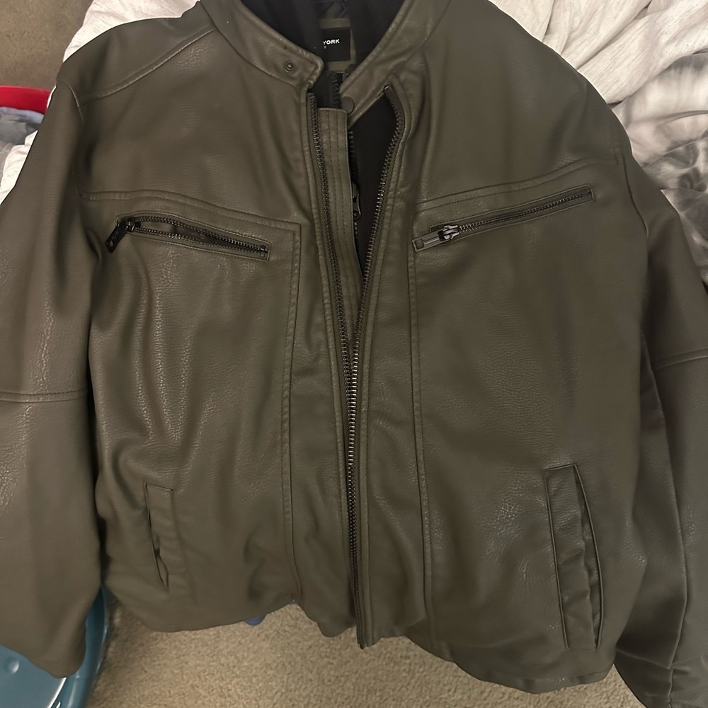 Leather jacket with black hoodie.